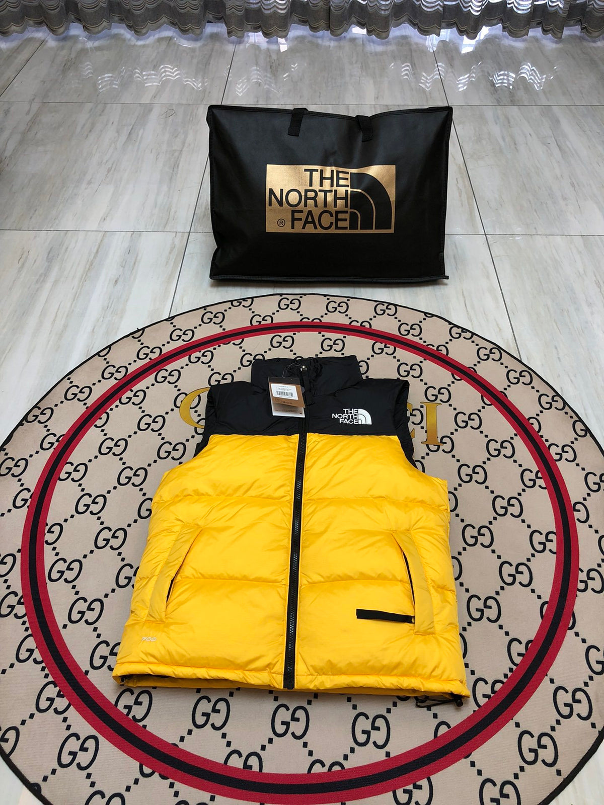 The North Face Yellow and Black Colorblock Puffer Vest